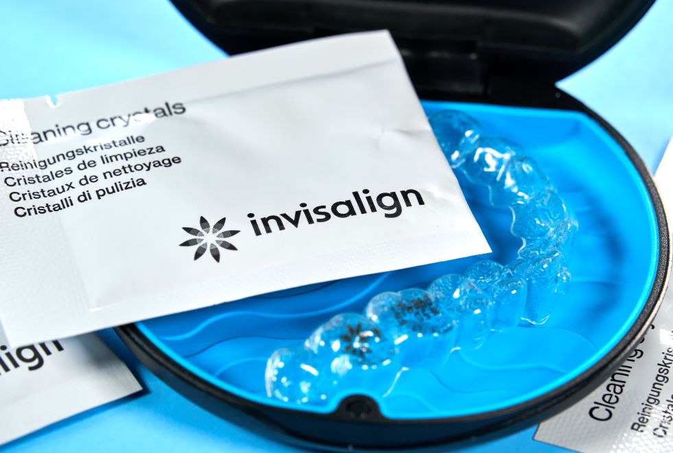 An invisalign aligner and cleaning crystals